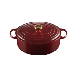LE CREUSET Cocotte en Fonte Ovale 31 cm Garnet Bouton Doré Signature Hot